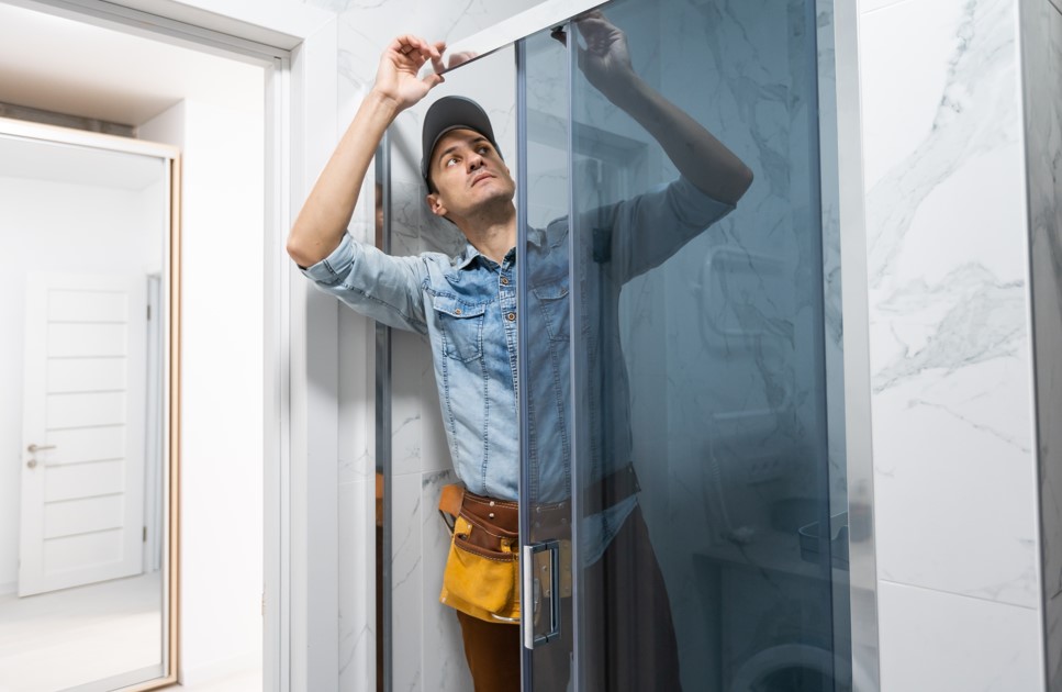 professional installing a shower enclosure