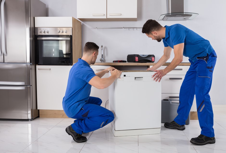 professionals installing a dishwasher